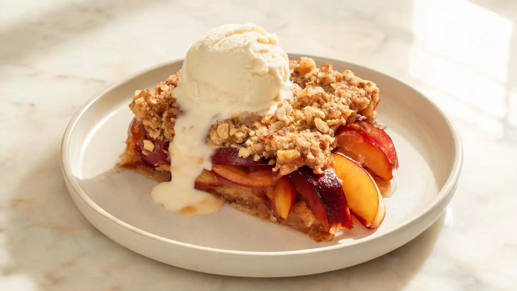 Fresh peaches, plums and nectarines arranged for late-summer stone fruit desserts